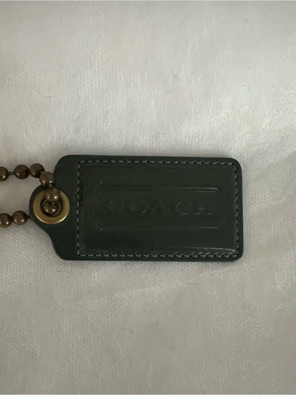 Coach Dark Green Patent Leather Hangtag